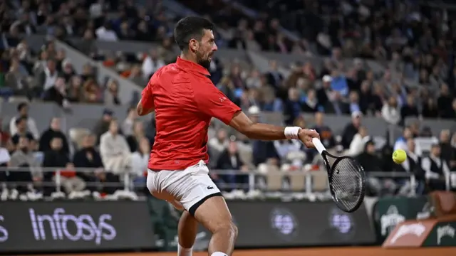 Novak Djokovic hits a forehand