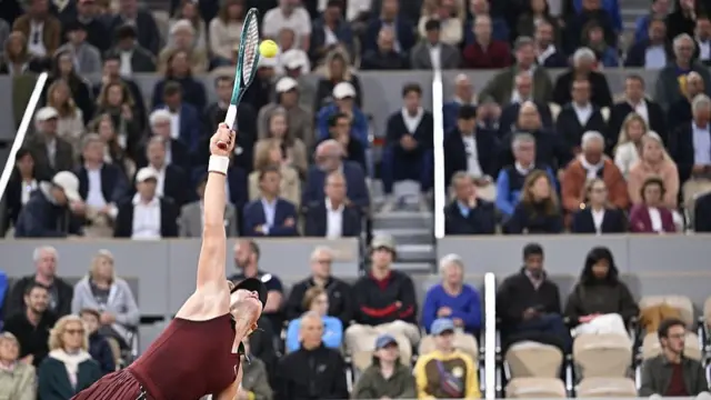 Mirra Andreeva serves