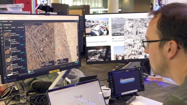 Paul Brown looking at specialist satellite imagery of Gaza