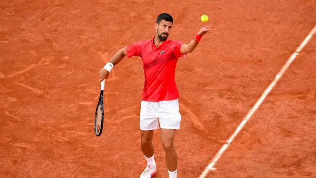 Novak Djokovic of Serbia serves