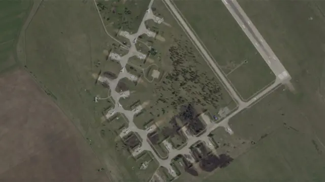 Another image of the airfield shows damaged aircraft on a dispersal area near the runway