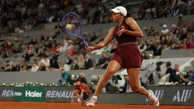 Madison Keys plays a backhand return