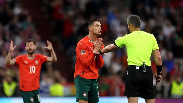 Ronaldo speaks to the referee