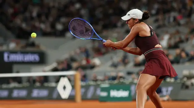 Madison Keys plays a backhand