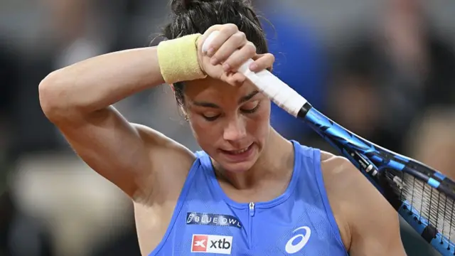 Lois Boisson wipes her face
