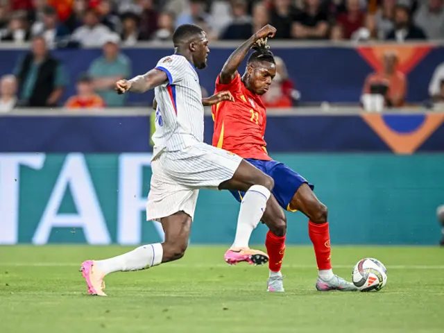 Ibrahima Konate of France and Nico Williams of Spain battle for the ball