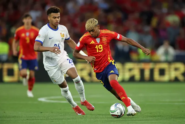Lamine Yamal of Spain runs ahead of Desire Doue