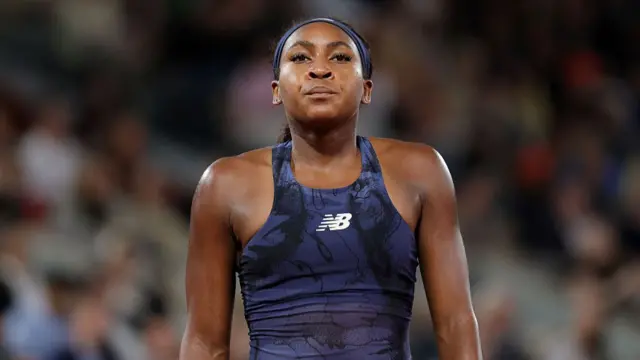 Coco Gauff looks on