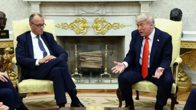 Trump and Merz sat on chairs in Oval Office.