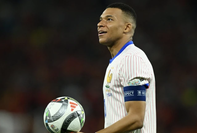 France's Kylian Mbappe looks on