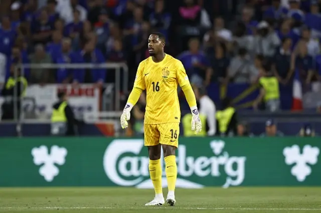 France goalkeeper Mike Maignan looks on