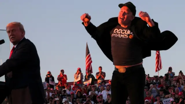 Tesla CEO and X owner Elon Musk jumps on stage next to then Republican presidential nominee Donald Trump in October 2024.