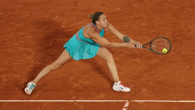 Aryna Sabalenka plays a backhand