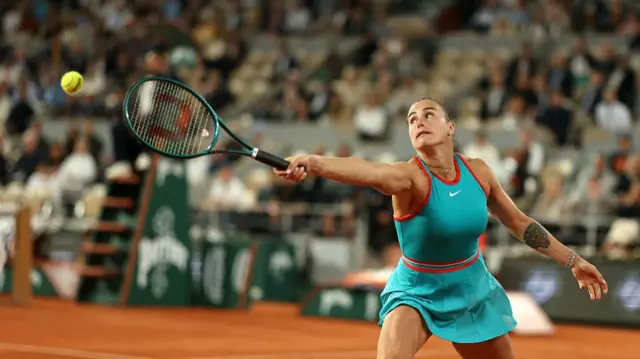 Aryna Sabalenka plays a backhand return