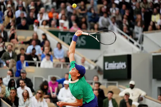 Jannik Sinner serves
