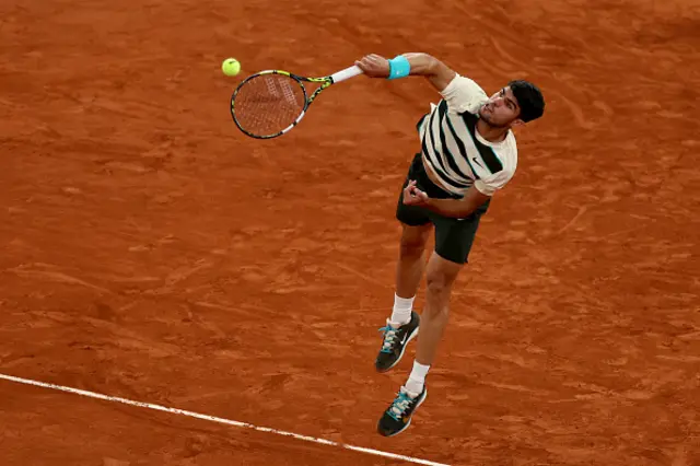 Spain's Carlos Alcaraz serves to Italy's Lorenzo Musetti