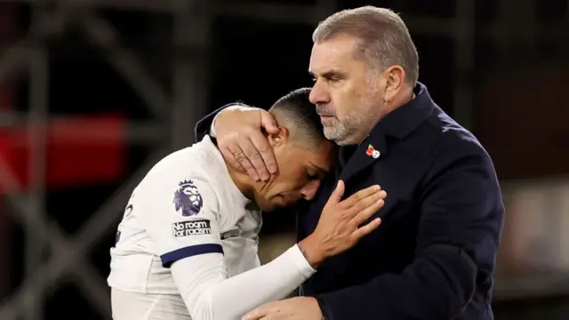 Pedro Porro and Ange Postecoglou, Manager of Tottenham Hotspur, embrace