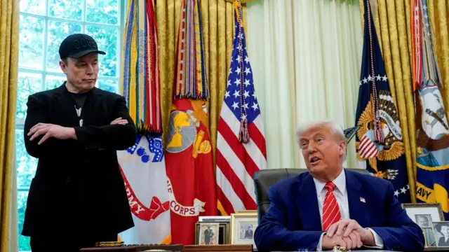 President Donald Trump and Elon Musk attend a press conference in the Oval Office