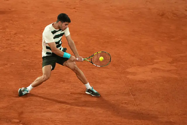 Spain's Carlos Alcaraz plays a backhand