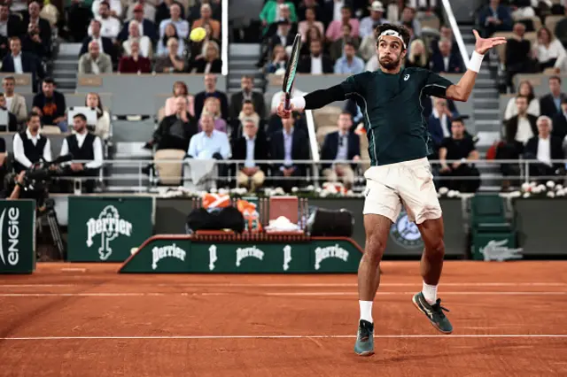 Italy's Lorenzo Musetti plays a backhand return