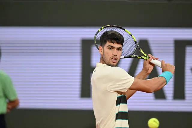 Carlos Alcaraz of Spain in action against Lorenzo Musetti