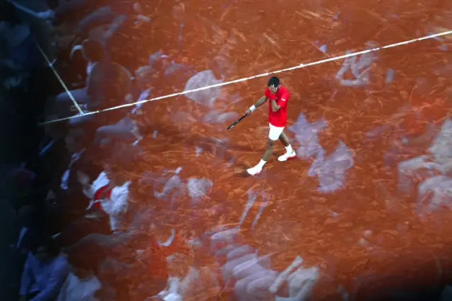 Serbia's Novak Djokovic reacts, with the spectators