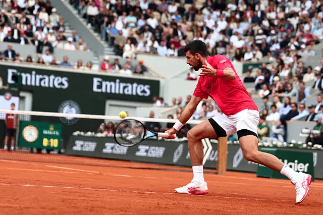 Novak Djokovic plays a drop shot