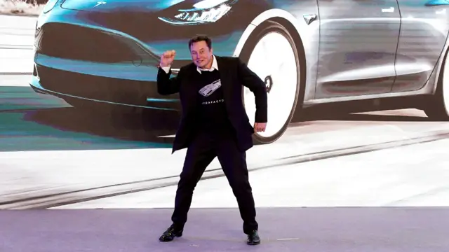 Tesla Inc CEO Elon Musk dances onstage during a delivery event for Tesla China-made Model 3 cars in Shanghai, China