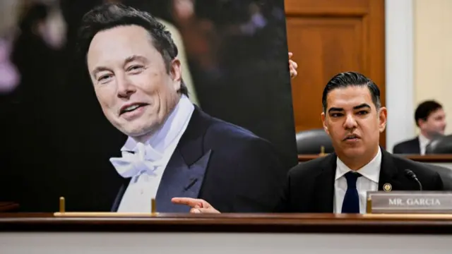 Robert Garcia points to an image of Elon Musk