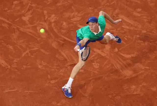 Jannik Sinner of Italy plays a backhand