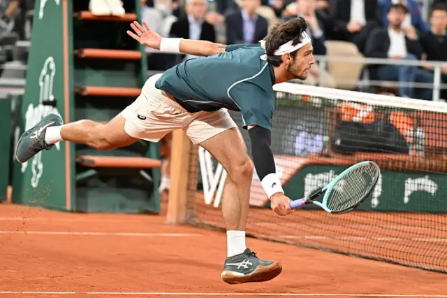 Lorenzo Musetti of Italy competes against Carlos Alcaraz