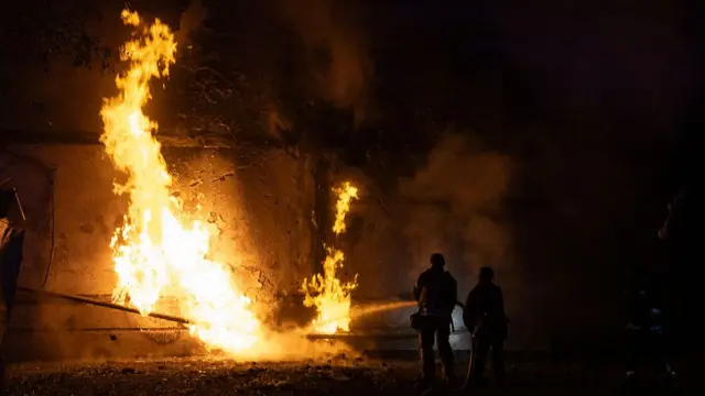 Firefighters extinguish a fire on pipe at residential district after a Russian night drone attack on 5 June 2025 in Kharkiv, Ukraine.