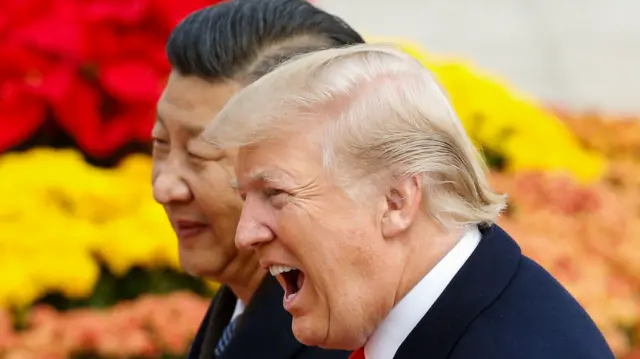 US President Donald Trump takes part in a welcoming ceremony with China's President Xi Jinping in Beijing, China
