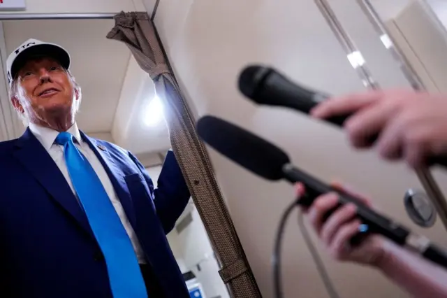 Trump speaking to reporters aboard Air Force One