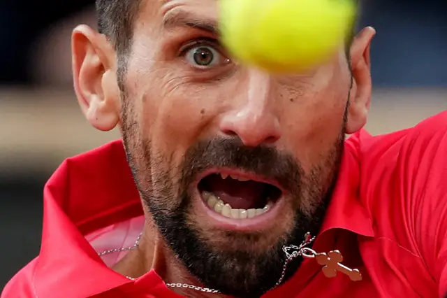 Serbia's Novak Djokovic eyes the ball