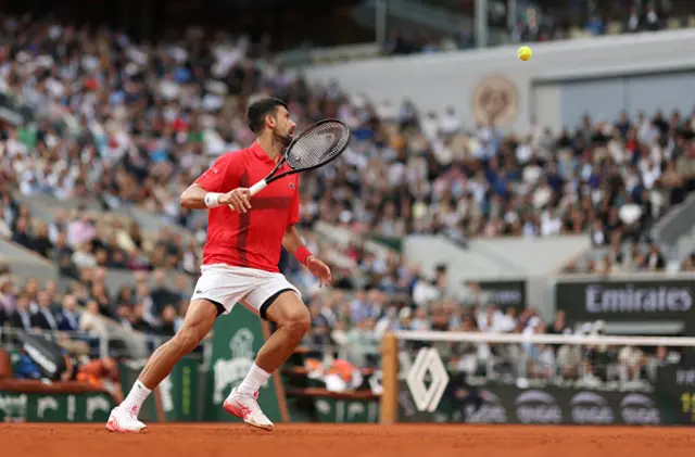 Novak Djokovic of Serbia watches a ball against Jannik Sinner