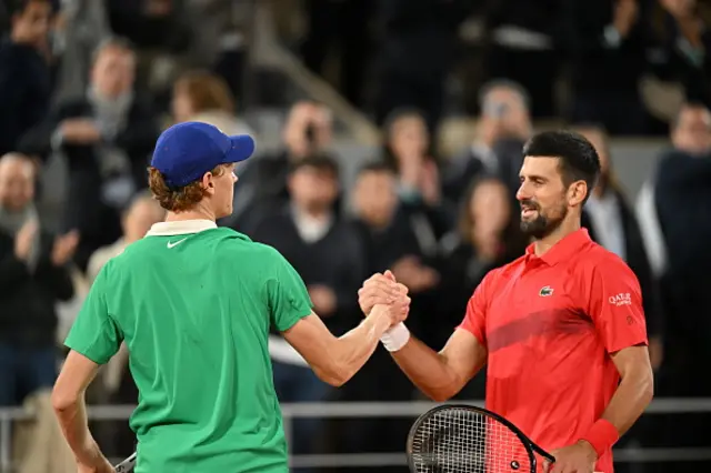 Italy's Jannik Sinner celebrates after competing against Serbia's Novak Djokovic