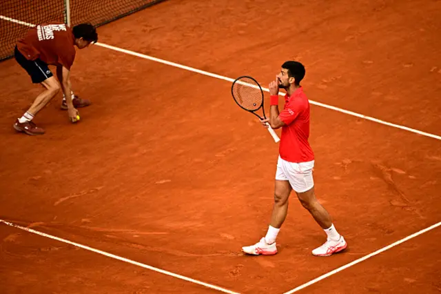 Serbia's Novak Djokovic makes a silence gesture to the spectators