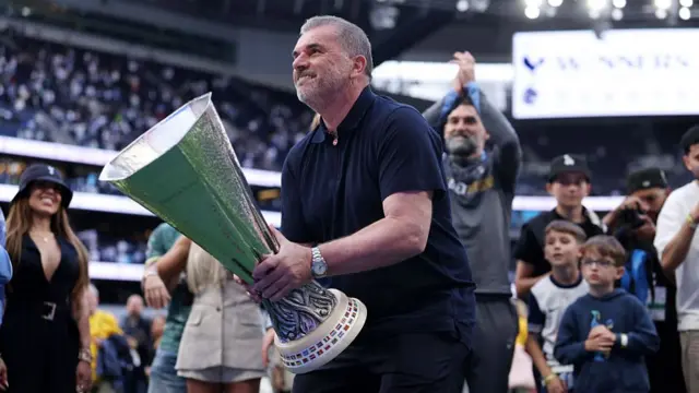 Ange Postecoglou manager of Tottenham Hotspur celebrates with the UEFA Europa League Trophy