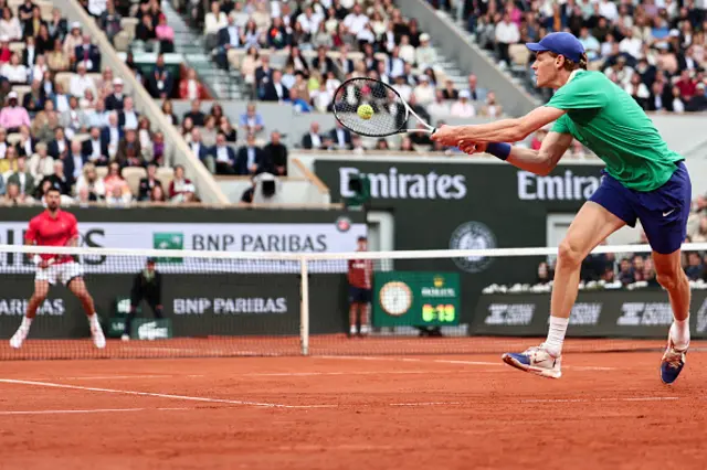 Italy's Jannik Sinner plays a backhand return