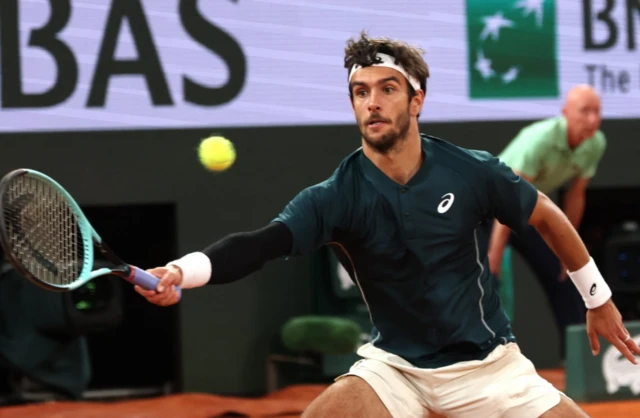 Lorenzo Musetti of Italy in action during his Men's Singles semi-finals match against Carlos Alcaraz