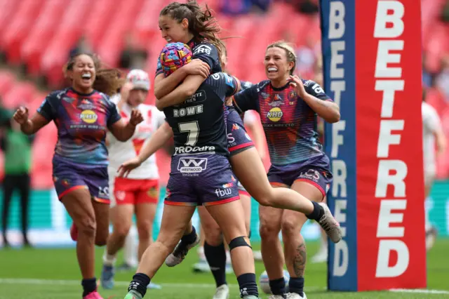 Isabel Rowe celebrates scoring for Wigan