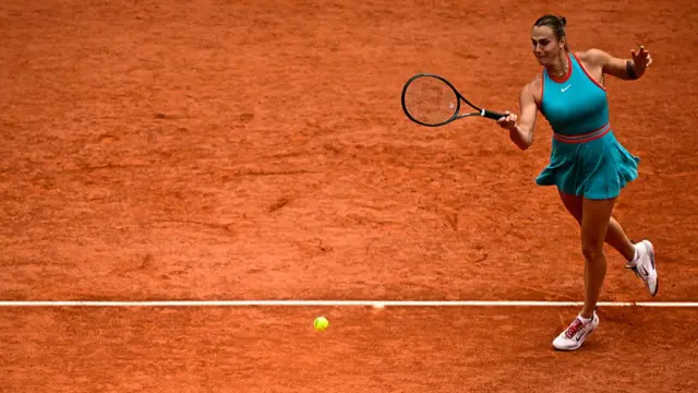 Aryna Sabalenka plays a forehand return