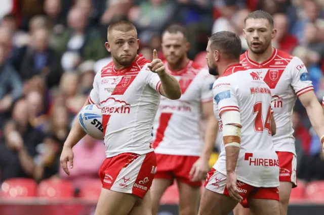 Hull KR's Mikey Lewis points to the posts before kicking a penalty