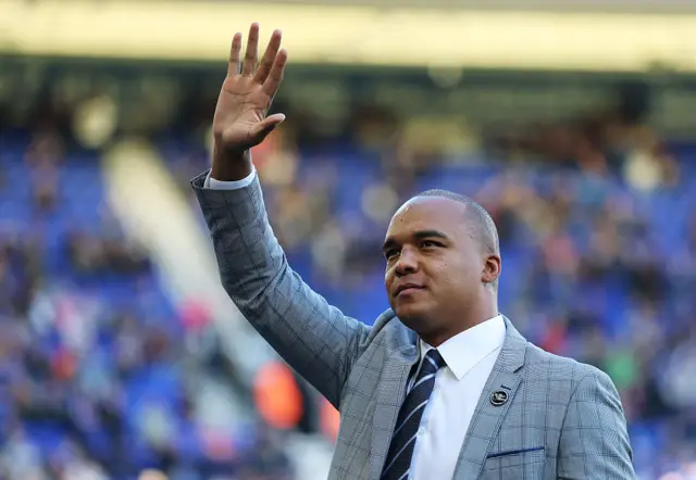 Fabio Wardley waving to the crowd in a suit