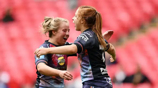 Grace Banks celebrates scoring for Wigan