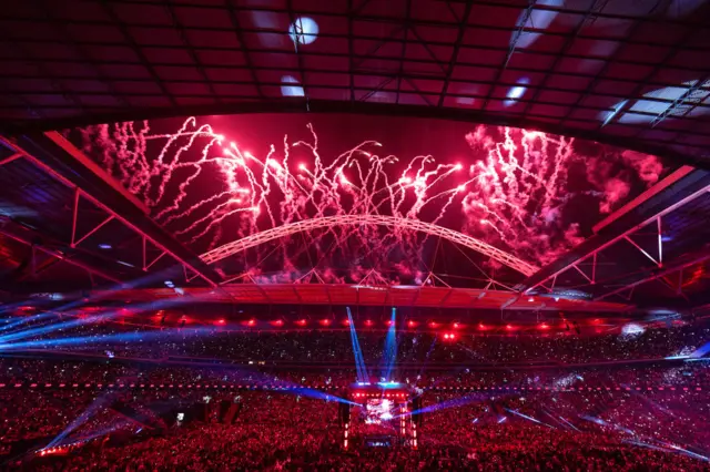 Wembley Stadium with fireworks coming out the arch