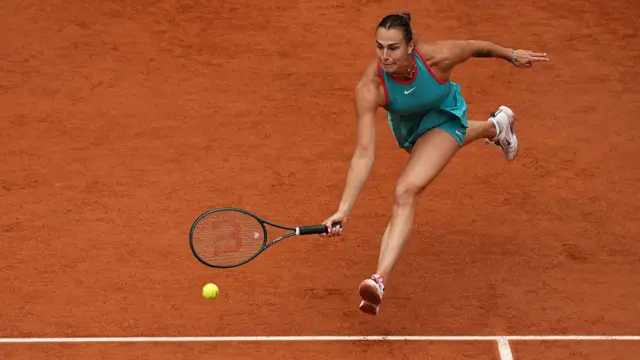 Aryna Sabalenka plays a forehand return