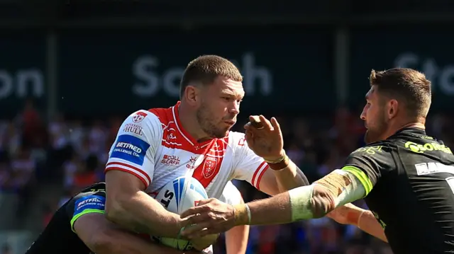 A photo of Hull KR's James Batchelor getting tackled