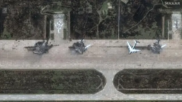 A satellite image showing the remains of destroyed Russian jets on an airfield